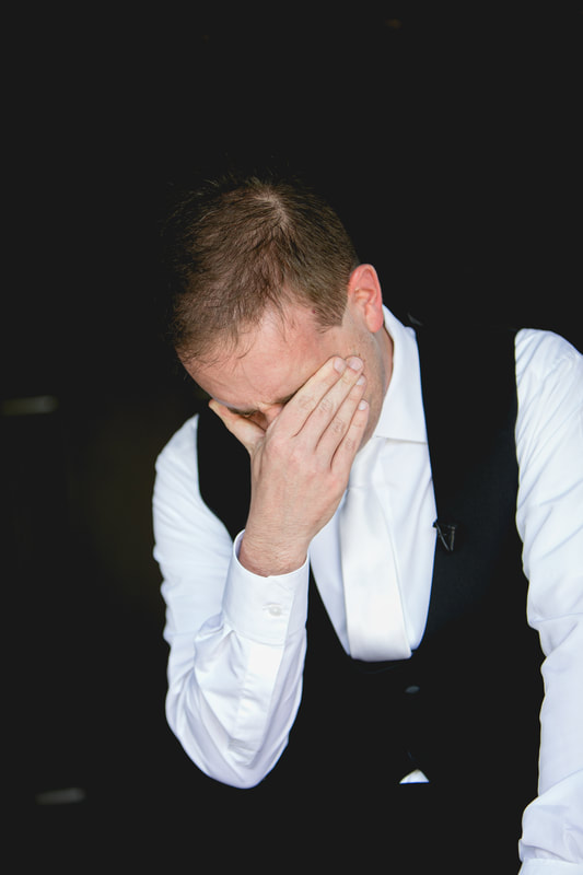 Groom crying from letter