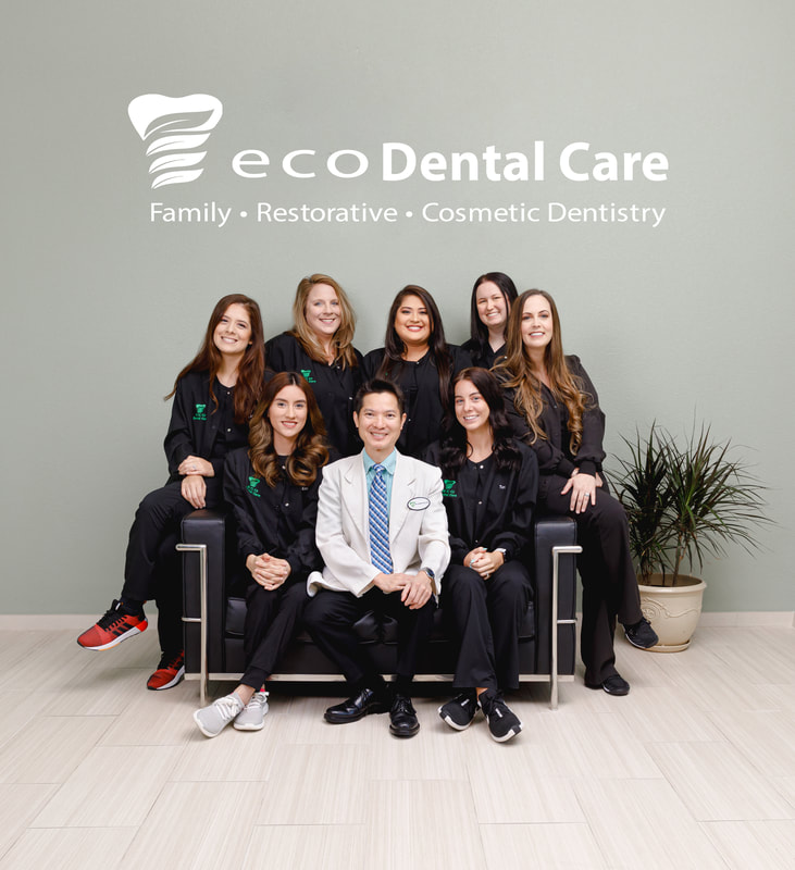 group photo of dentist and team
