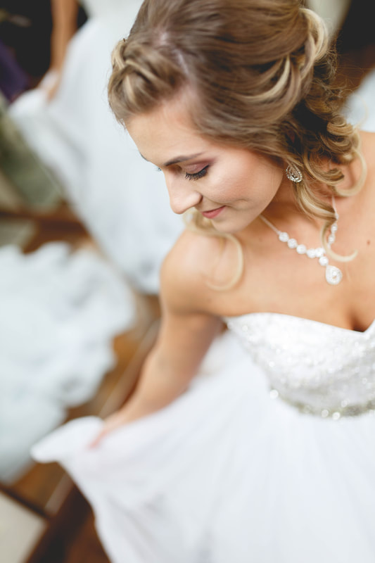 Bride showing off wedding dress